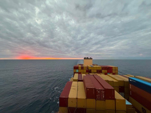 Container Ship at Sea During Sunset. Photograph by Mukund Jha, 2025. Personal photograph. Used with permission